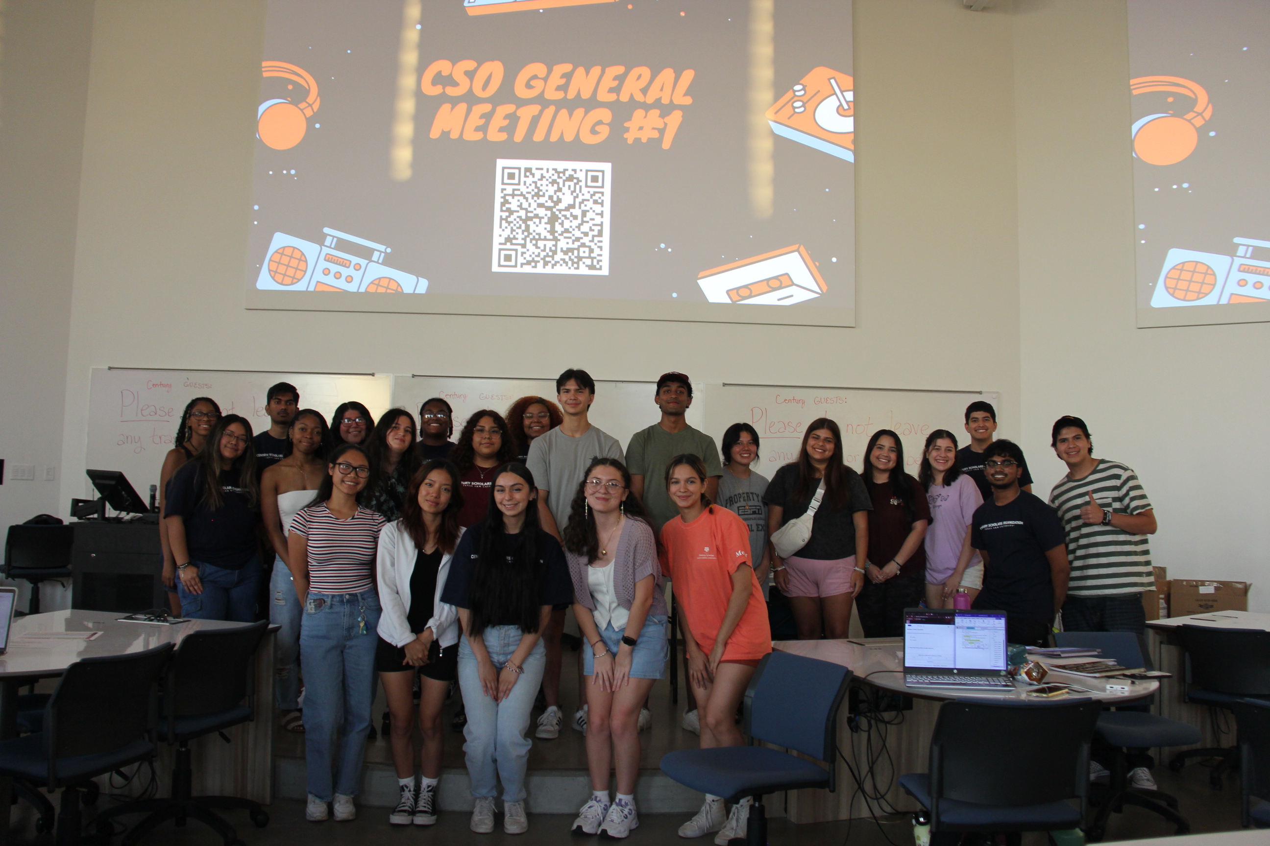 Century Scholars Organization members smiling together in a classroom during their first general member meeting of 2023.
